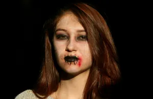 Bruised Girl With Black Lipstick Wallpaper