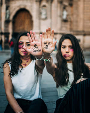 Bruised Girls Showing Their Palms Wallpaper