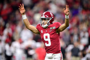 Bryce Young Alabama Quarterback Signaling Play Wallpaper