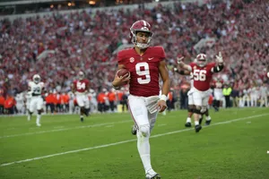 Bryce Young In Action At Football Game Wallpaper