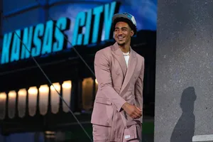 Bryce Young Smilingin Pink Suit Wallpaper