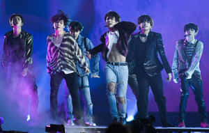 Bts Amazes The Crowd With An Electrifying Performance Wallpaper