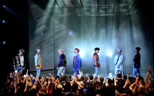 Bts Group Photo On Stage Wallpaper