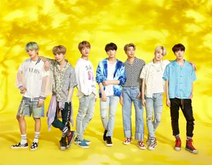 Bts In A Vibrant Music Video Scene Wallpaper