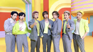 Bts Performing In Their Captivating Music Video Wallpaper