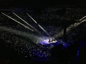 Bts Performing On Stage With Energetic Dance Routines And Powerful Vocals Wallpaper