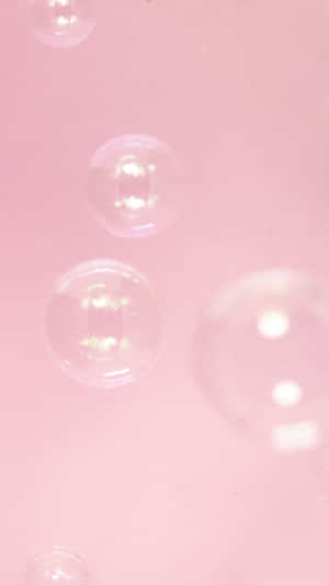 Bubbles Floating In A Pink Liquid Wallpaper