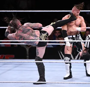 Buddy Murphy Kicked By Aleister Black Wwe Tlc 2019 Wallpaper