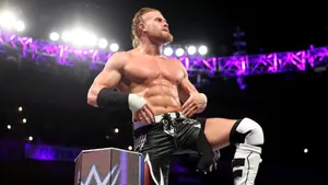 Buddy Murphy Striking A Powerful Pose At Wwe 205 Live Event. Wallpaper
