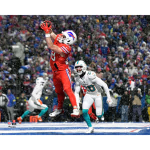 Buffalo Bills Player Catching Footballin Snow Wallpaper