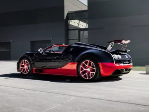 Bugatti Veyron - A Black And Red Sports Car Wallpaper