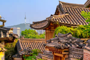 Bukchon Hanok Villagewith Seoul Tower Backdrop Wallpaper