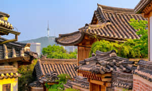 Bukchon Hanok Villagewith Seoul Tower Background Wallpaper