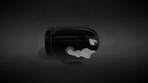 Bullet Bill Figure Black Background Wallpaper