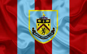 Burnley Fc Crest On A Blue Background Wallpaper