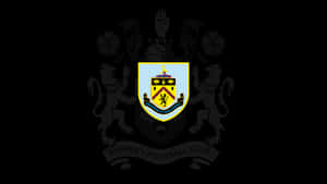 Burnley Fc Players In Action On The Field Wallpaper