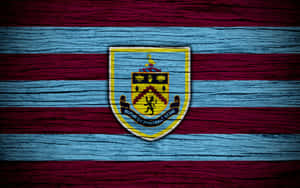 Burnley Fc's Passionate Fans Cheering At Turf Moor Wallpaper