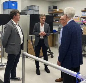 Businessmen Conversationin Lab Wallpaper