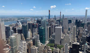 Bustling_ Metropolis_ Skyline_ View.jpg Wallpaper