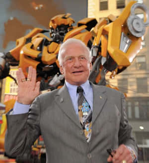 Buzz Aldrin Wavingin Frontof Transformer Wallpaper