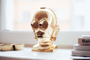 C-3po, The Golden Humanoid Droid In A Dynamic Pose Wallpaper