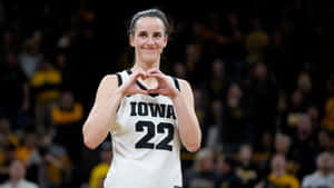 Caitlin Clark Iowa Basketball Heart Gesture Wallpaper