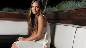 Caitlin Stasey In Chic Attire Wallpaper