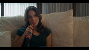 Caitlin Stasey Sipping Coca Cola Wallpaper