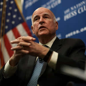 California Governor Jerry Brown In Support Of The American Flag Wallpaper