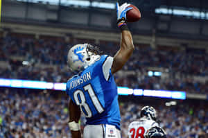 Calvin Johnson Catching Football Game Wallpaper