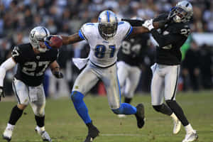 Calvin Johnson Evading Tackles During Game Wallpaper