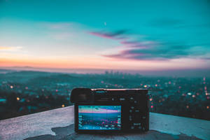 Camera Capturing City Lights Wallpaper