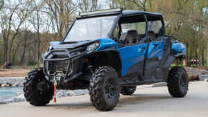 Can Am Off Road Vehicle Parked Outdoors Wallpaper