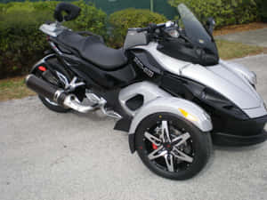 Can Am Spyder Motorcycle Parked Outdoors Wallpaper