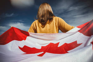 Canadian Woman Yellow Shirt Wallpaper