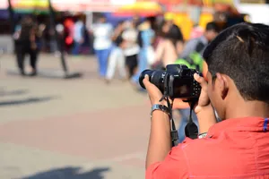 Candid Cameramanat Festival Wallpaper