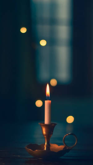 Candle On Golden Holder Wallpaper