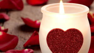 Candle Surrounded By Petals Wallpaper