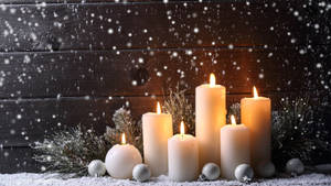 Candles In A Snowy Place Wallpaper