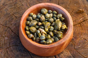 Capers In A Brown Clay Pot Wallpaper