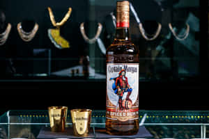 Captain Morgan Spiced Rum Bottleand Shot Glasses Wallpaper