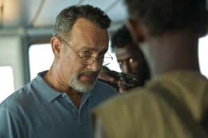 Captain Phillips Engaged In A Tense Standoff Wallpaper