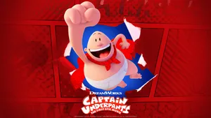 Captain Underpants: The First Epic Movie Punching Through A Page Wallpaper