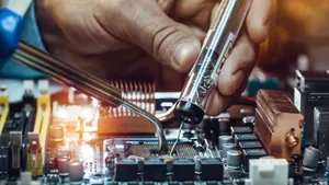 Caption: A Close-up View Of Intricate Electronic Components Wallpaper