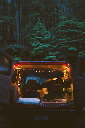 Caption: A Cozy Campsite In A Snowy Winter Wonderland. Wallpaper