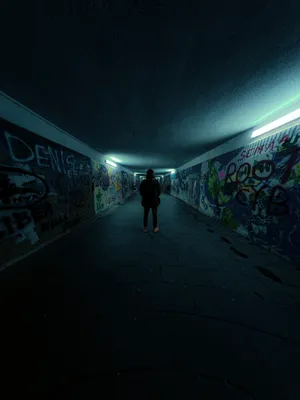 Caption: A Mysterious Stairway In A Dark Underground Tunnel Wallpaper