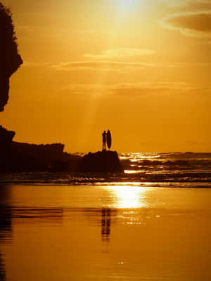 Caption: A Picturesque Yellow Beach Scene At Sunset Wallpaper