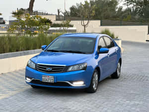 Caption: A Pristine Geely Emgrand In Sunset Backdrop Wallpaper