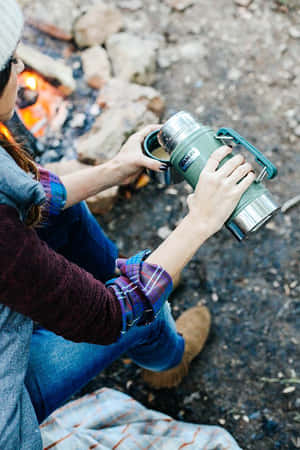 Caption: A Relaxing Minimalist Camping Scene With A Tent And Nature View Wallpaper