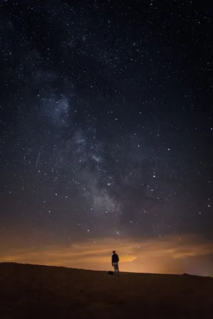Caption: A Romantic And Chilly Night Beneath A Star-filled Sky Wallpaper